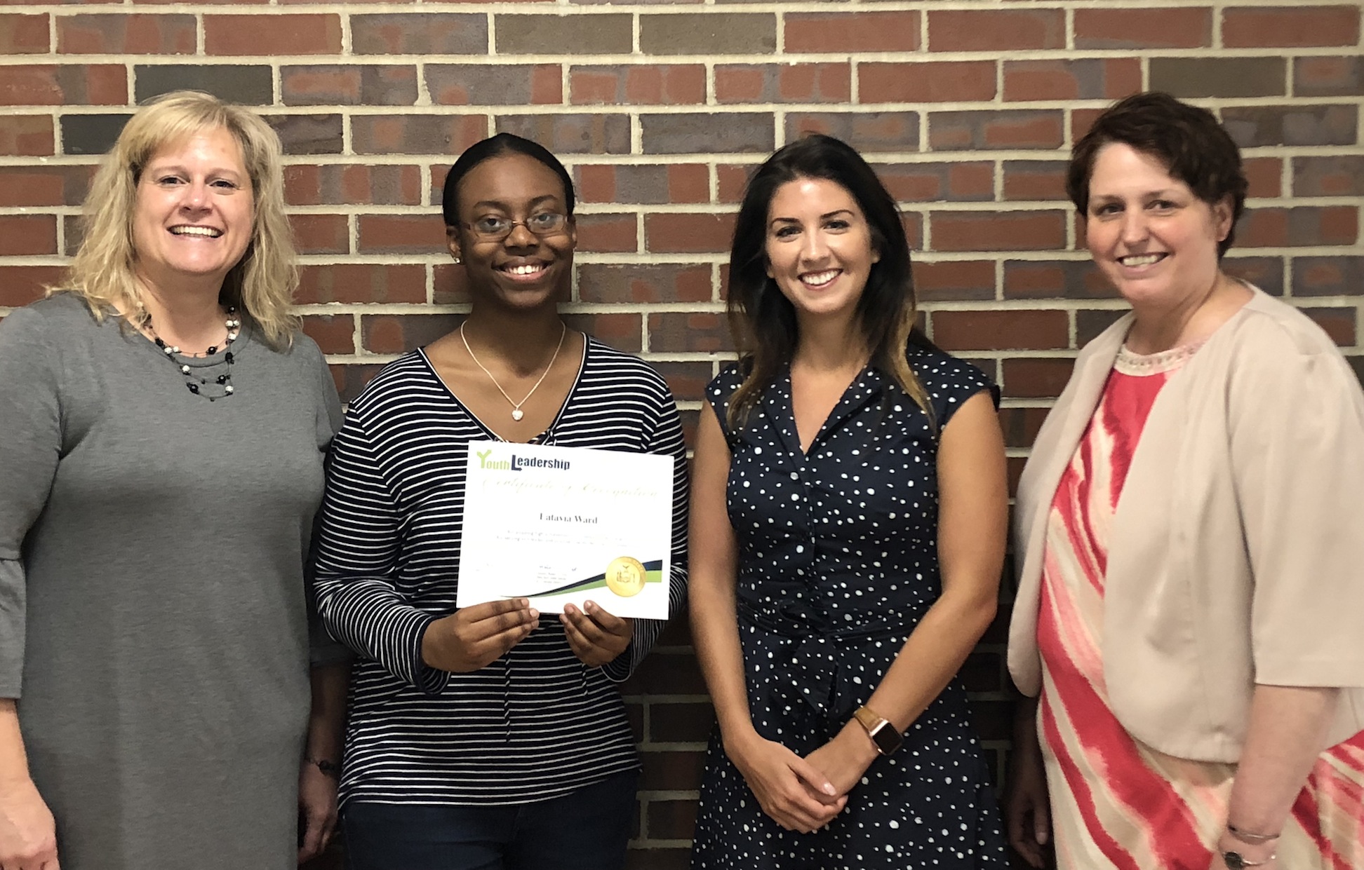 From left, Laura Koeppel, Latavia Ward, Madeline Genovese and Niagara Career and Tech Ed Center Principal Leslie Tanner.